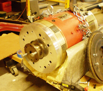 DC electric motor has custom drive flange for flywheel