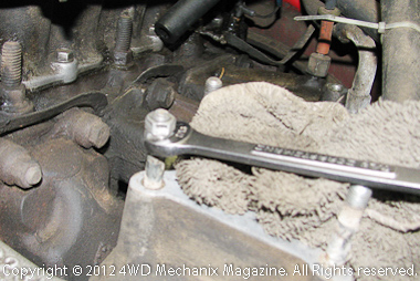 Double-nut method for removing intake manifold studs