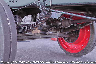 Rear beam axle with driveshafts above the beam