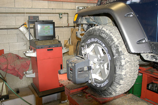 Complete four-wheel alignment and center steering wheel.